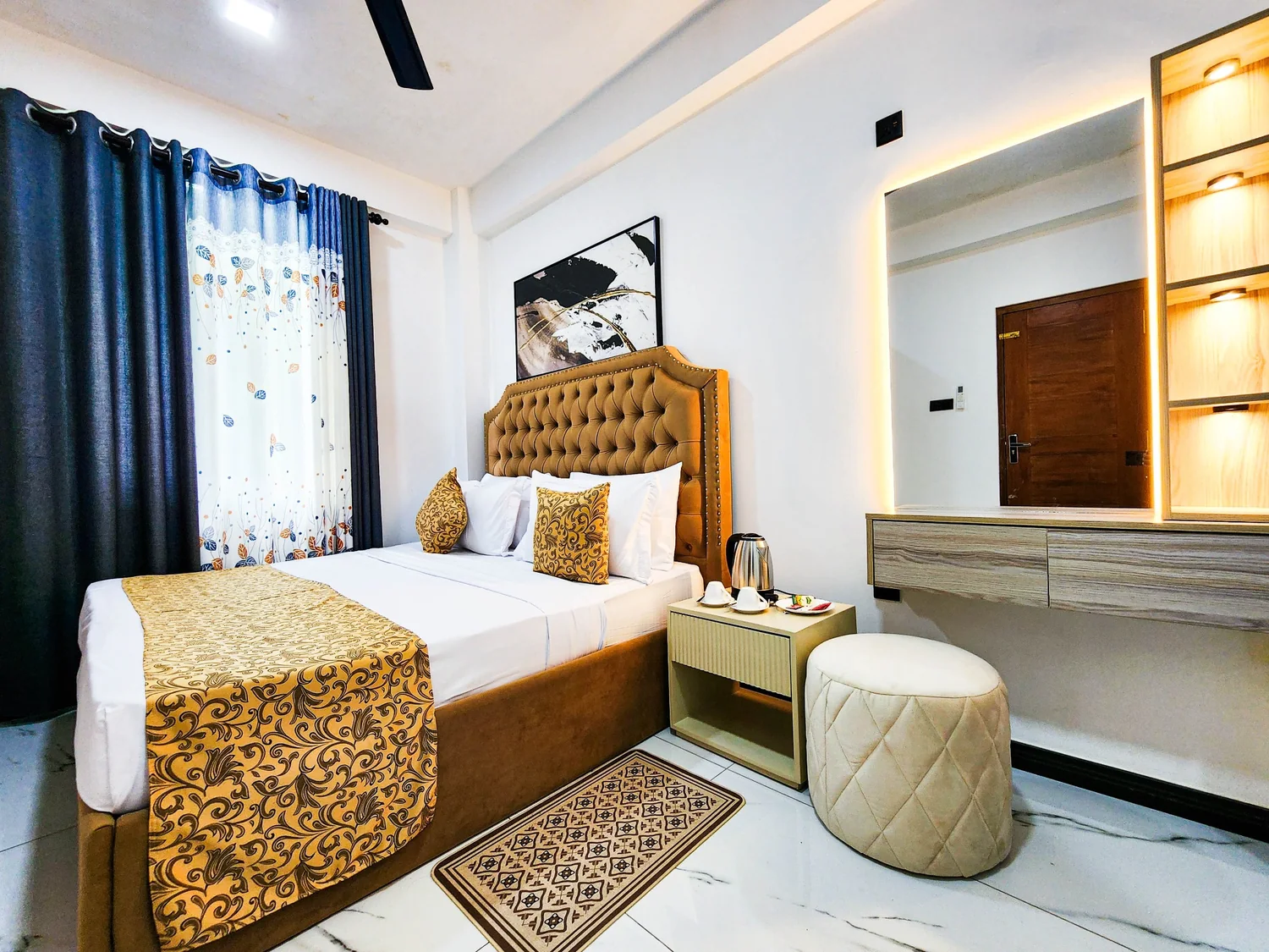 Warmly styled Villa 777 bedroom with gold accents
